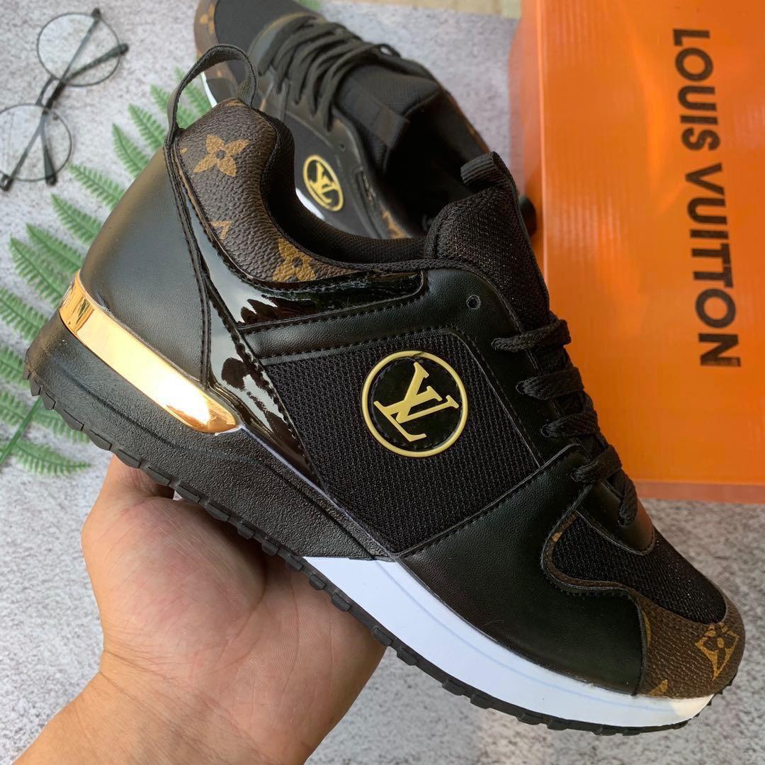 Black and brown sneaker with gold accents
