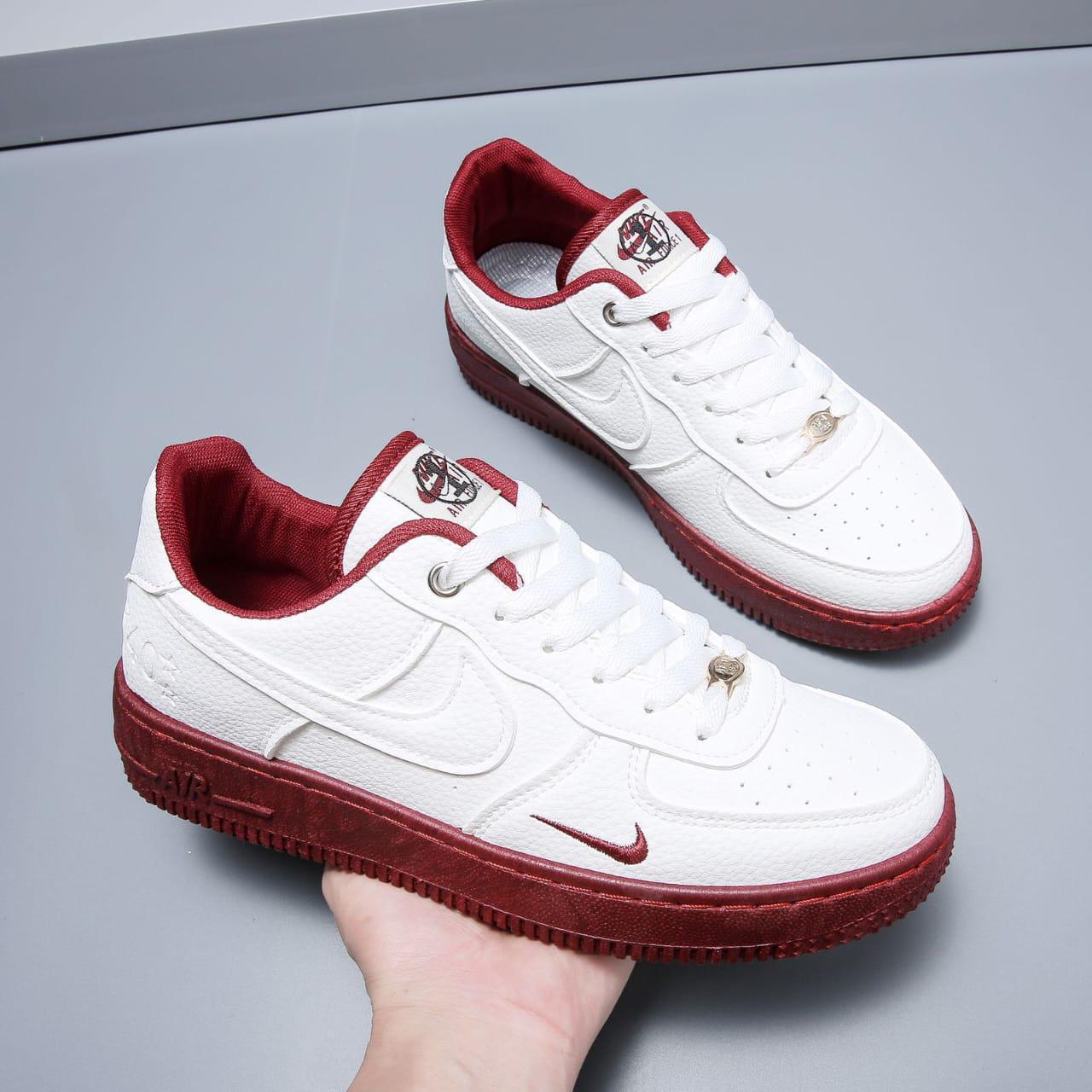 White sneakers with red soles