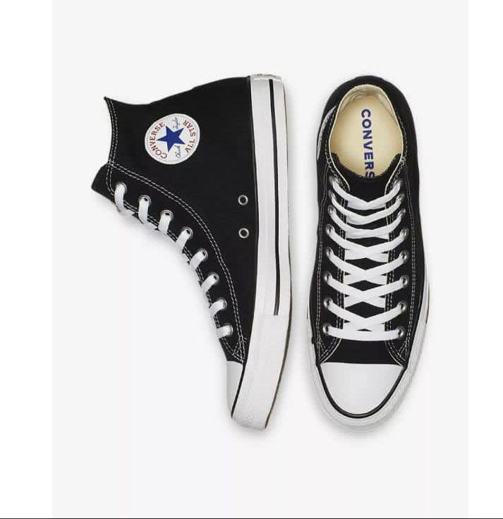 Black Converse sneakers with white laces