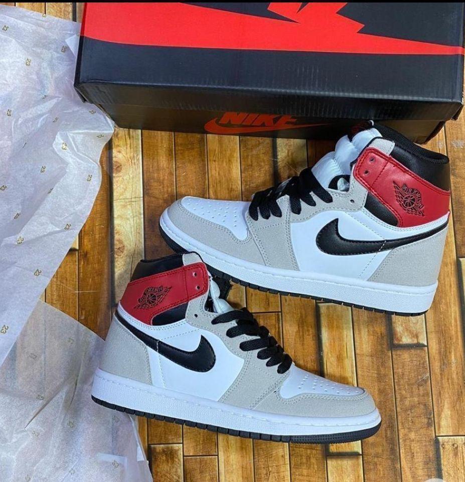 high-top sneakers with red, black, and white design
