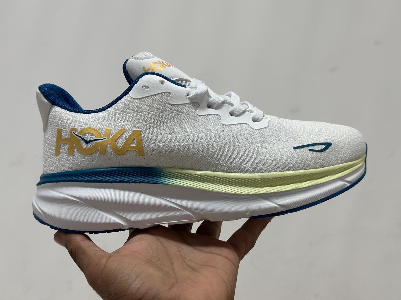 White running shoe with blue and yellow accents