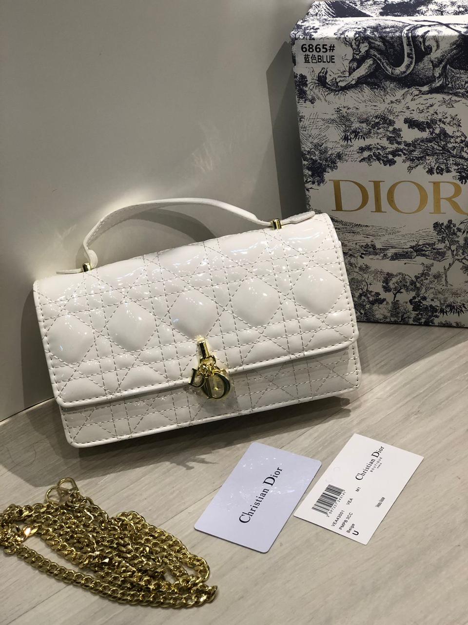 White handbag with gold chain
