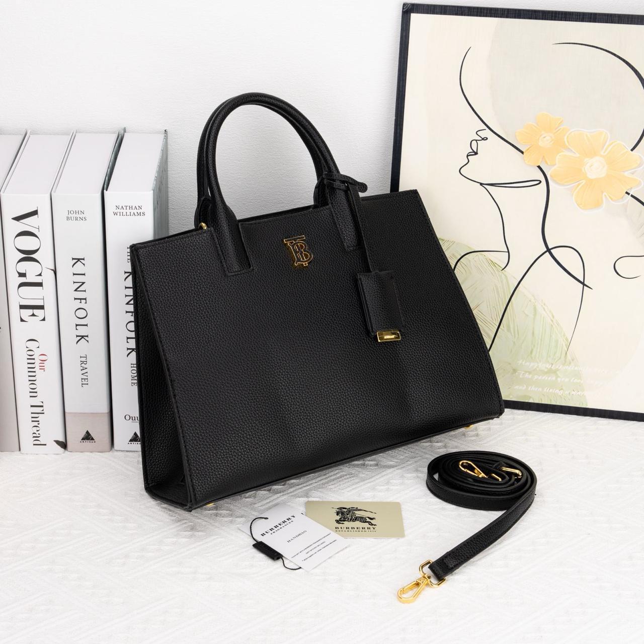 Black handbag with gold accents