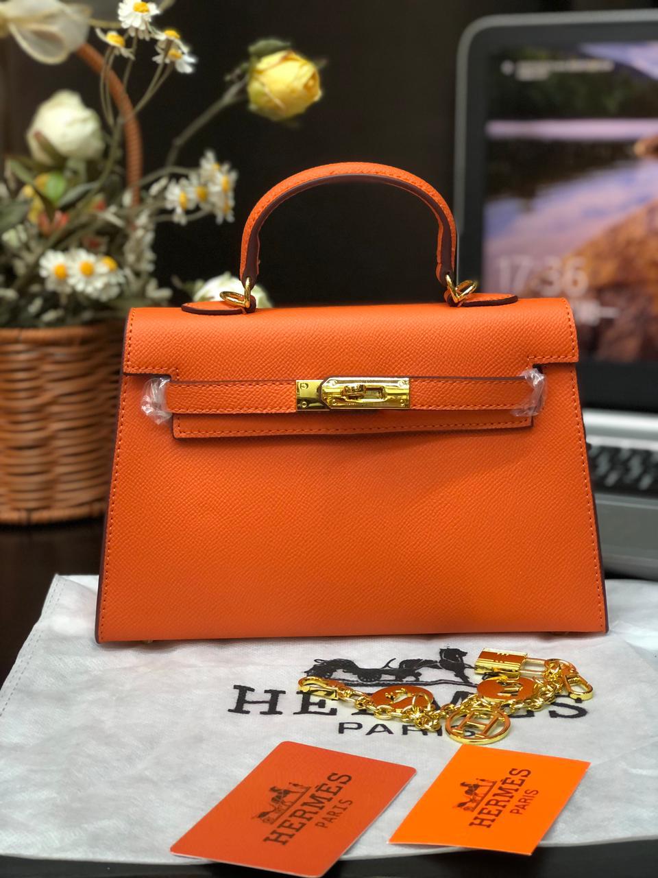 Orange handbag with gold hardwar