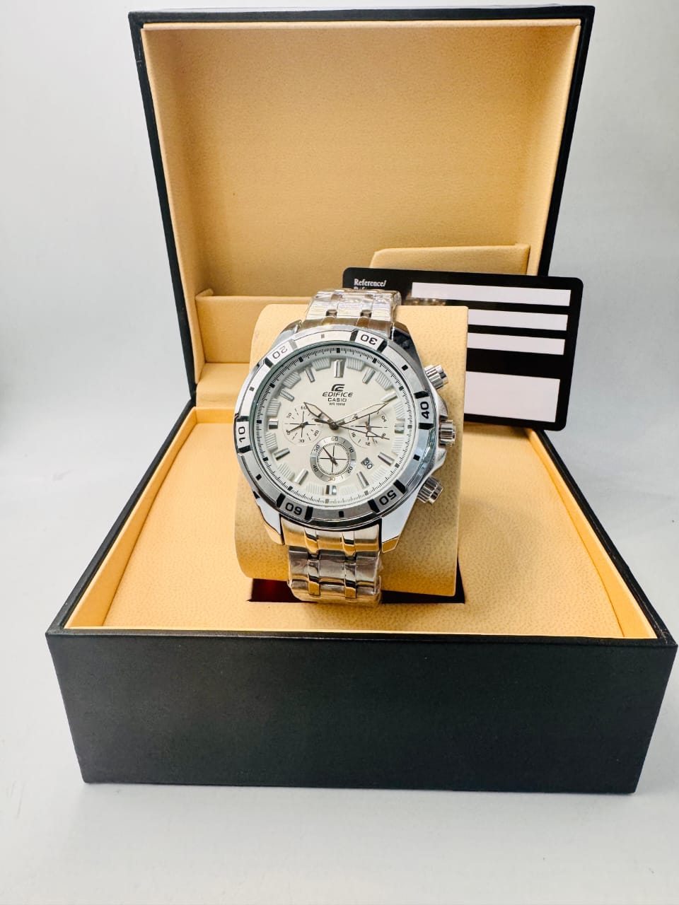 Silver watch with a white face