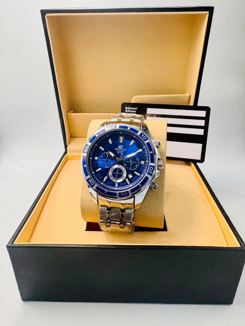 Silver watch with a dark blue face