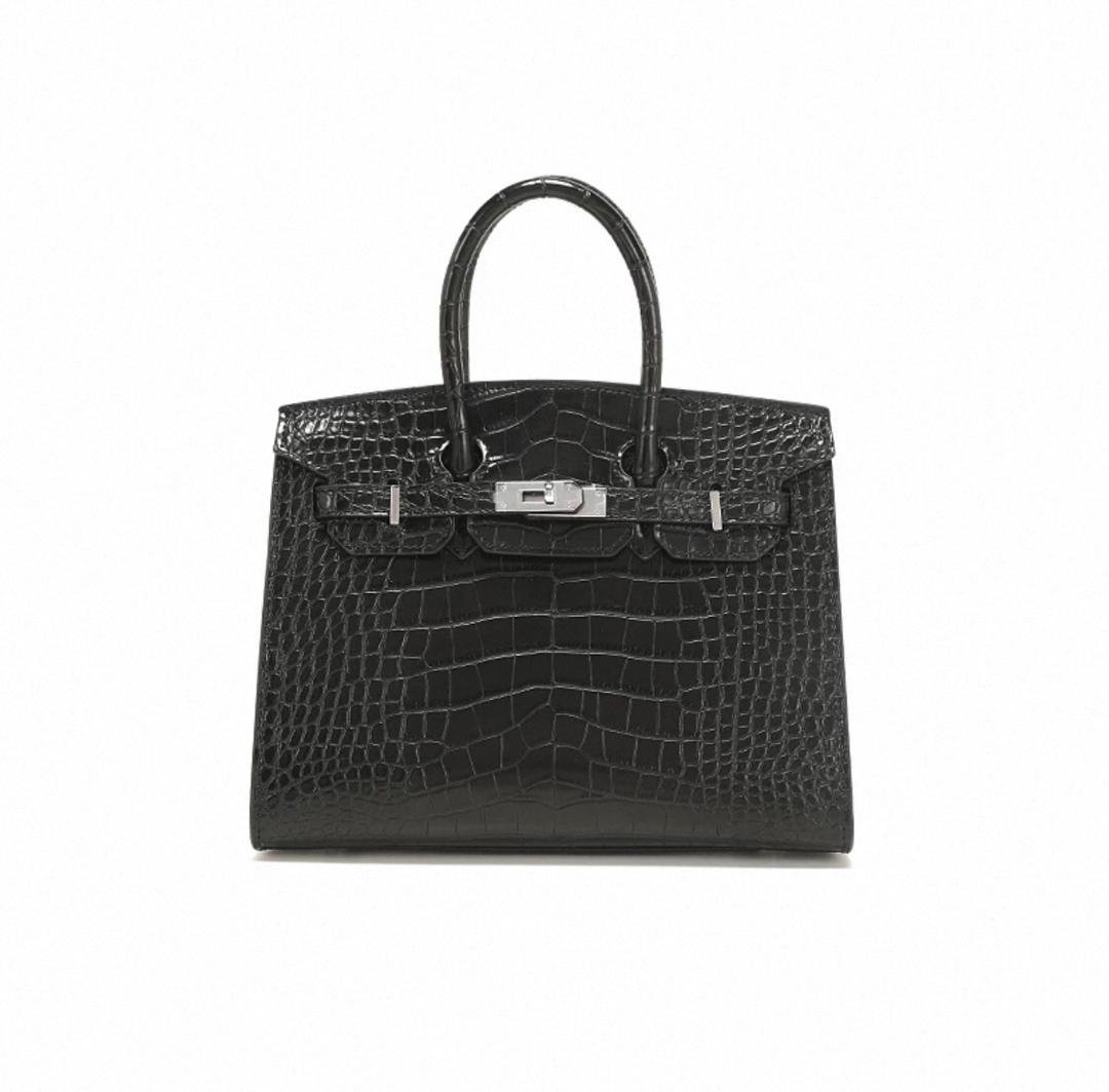 Black crocodile skin handbag